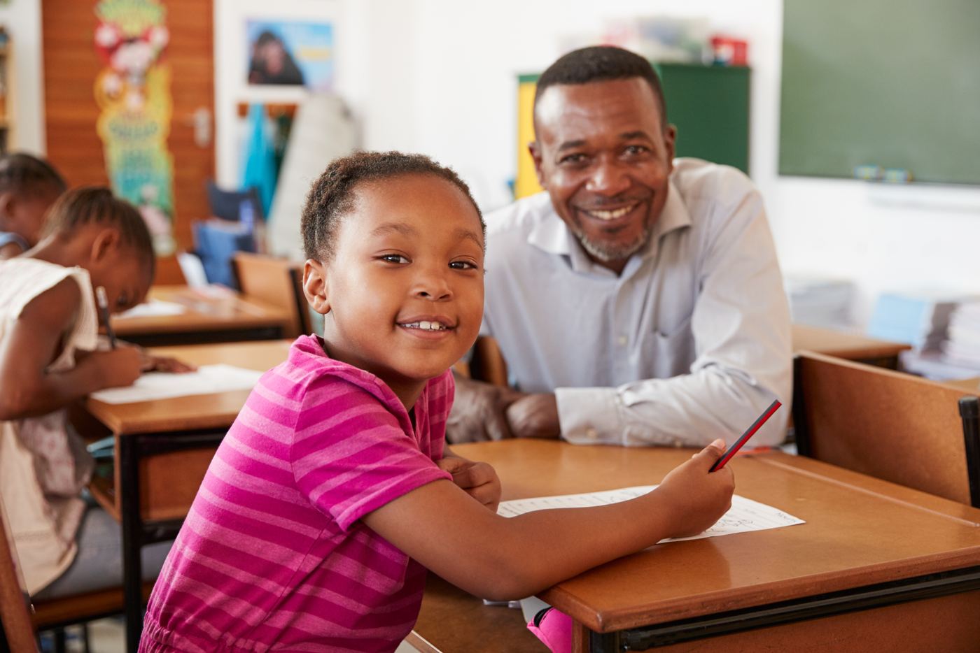 Tutor helping a child with their work